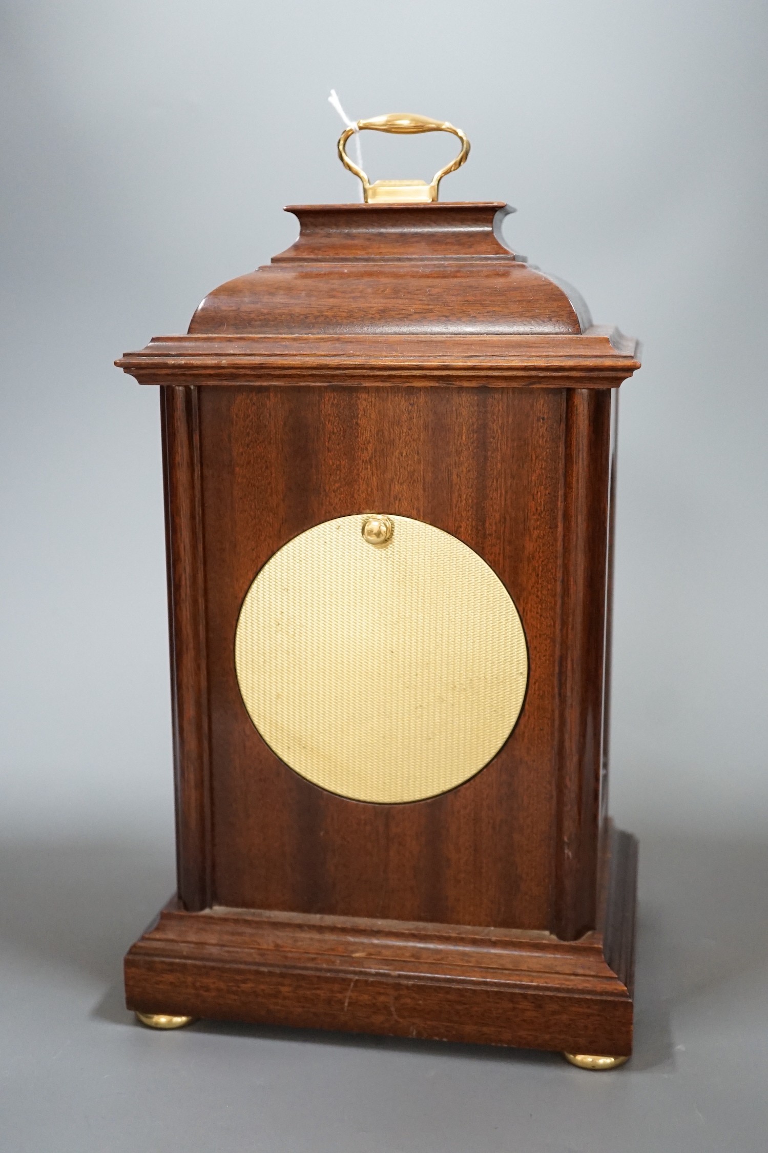 Knight and Gibbins. A reproduction mantel clock, 30c high